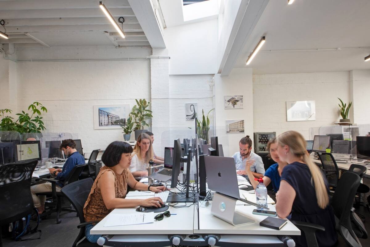 Architects working around a table in the studio